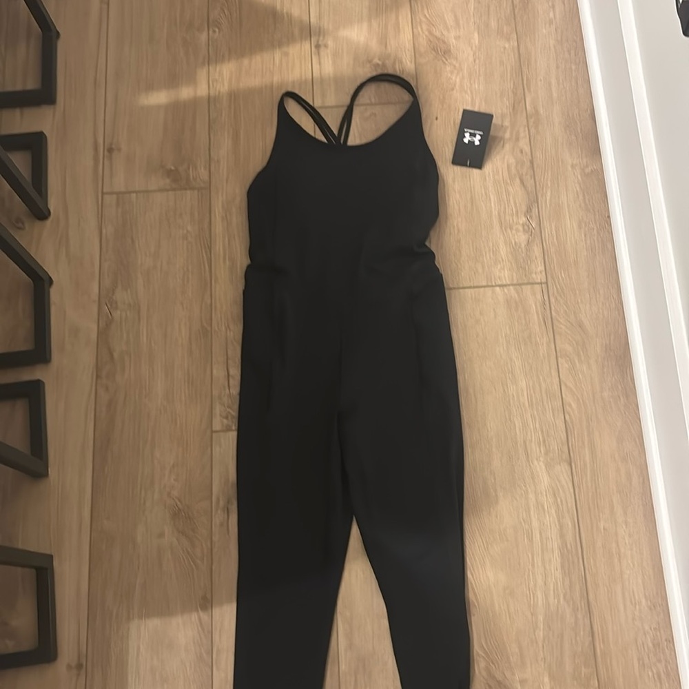 New with tags UA Woman’s bodysuit black- M
